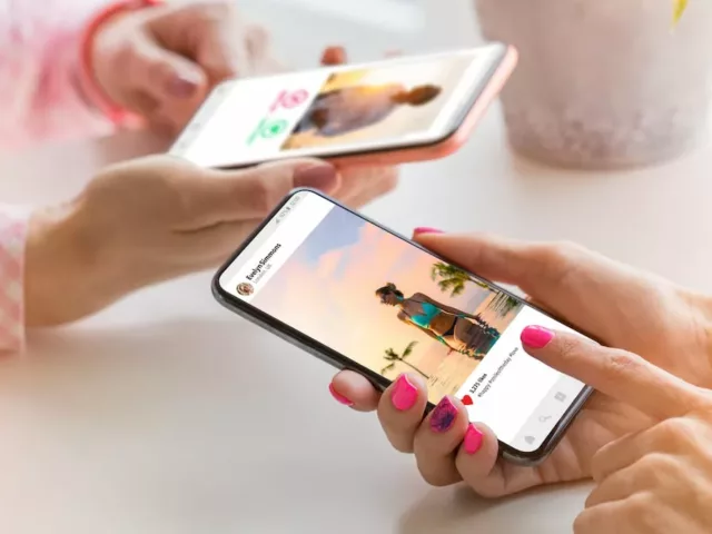 Two women on social media on smartphones